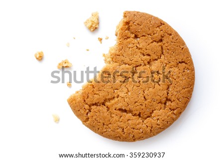 Single round ginger biscuit with crumbs and bite missing, isolated on white from above.