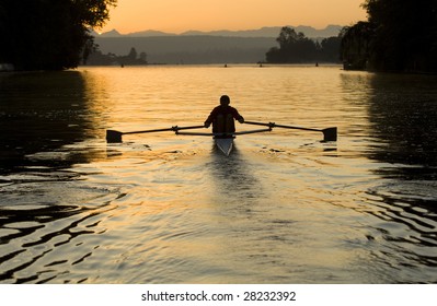 Single Rower At Sunrise