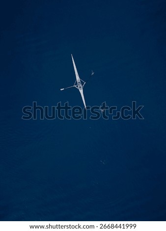Single Rowing Boat on Deep Blue Sea