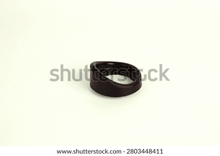 Single rubber eyecup for a microscope eyepiece isolated on a white background. Optical accessory designed to improve viewing comfort and reduce stray light during microscopic observation.