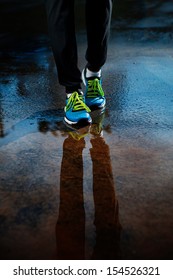 Single Runner Running In Rain