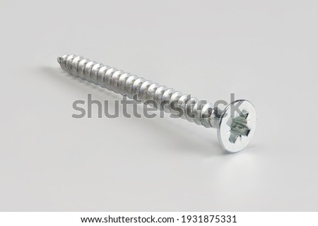 Single screw on a white background with no shallow dof.