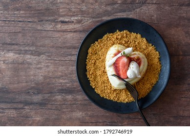 Single Serving Of Heart Shaped Creamy Italian Cheesecake On Graham Cracker Crumbles
