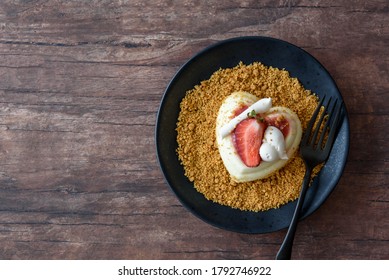 Single Serving Of Heart Shaped Creamy Italian Cheesecake On Graham Cracker Crumbles
