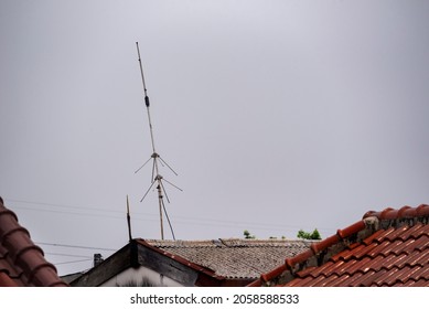 Single Side Band (SSB) High Frequency Radio Antenna On The Roof Of House