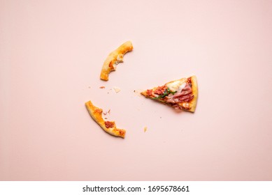 Single slice of pizza with prosciutto and crust leftovers on pink background. Last pizza slice flat lay. Italian traditional meal. Popular pizza. - Powered by Shutterstock