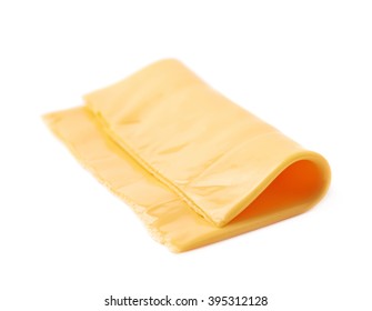 Single Slice Of Processed Wrapped Cheese Isolated Over The White Background