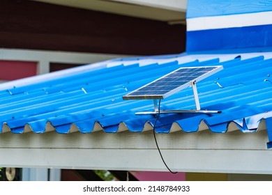 Single Solar Cell On Blue Roof Background