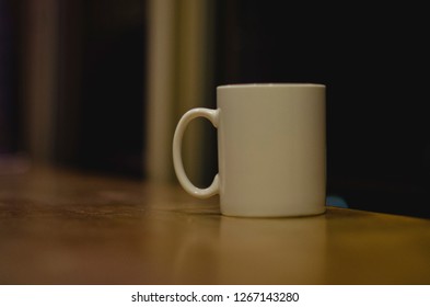 A Single Solo Coffee Cup In The Late Night Diner On The Classic Bar Window. 