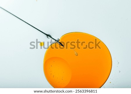 single sperm approaches an egg cell symbolizing IVF