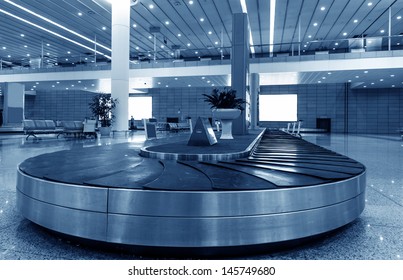 Single Suitcase Alone On Airport Carousel