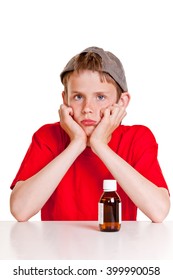 Single Sulking Teenager In Red Short Sleeved Shirt And Backwards Hat With Hands On Cheeks Next To Medicine Bottle