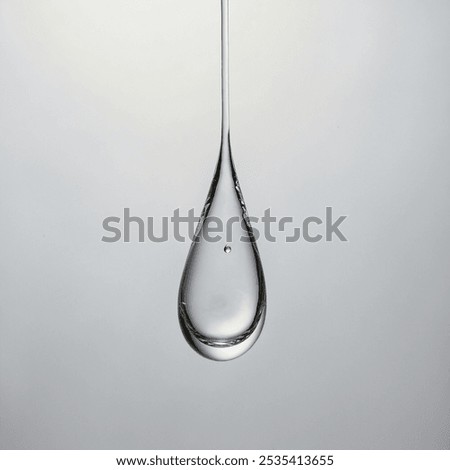 A single teardrop gently falls, capturing a moment of deep emotion—a delicate symbol of sorrow, relief, or profound feeling,