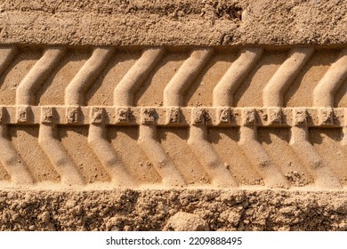 Single tire track on brown sand in construction site. Abstract background and pattern. - Powered by Shutterstock