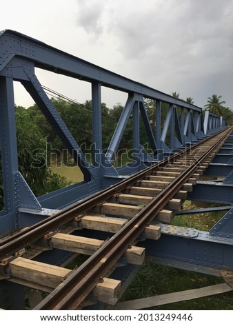 a single track railway bridge on a cloudy day