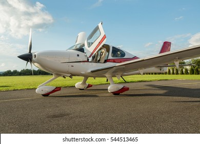 Single Turboprop Aircraft On The Ground In Sunny Day, Cirrus