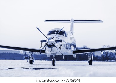 Single turboprop aircraft on winter runway. Pribram airport. Czech Republic