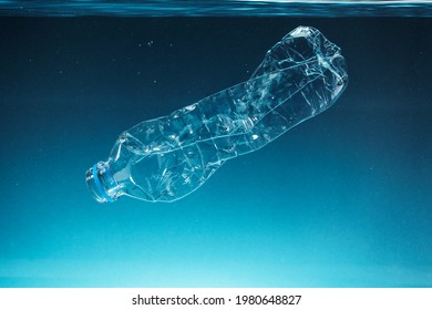 Single Use Plastic Bottle Floating In The Ocean