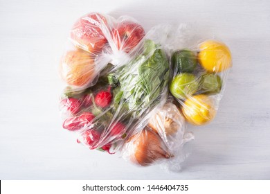 Single Use Plastic Packaging Issue. Fruits And Vegetables In Plastic Bags