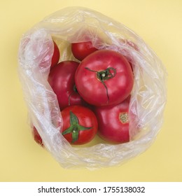 Single Use Plastic Packaging Issue.  Vegetables In Plastic Bags. Tomatoes In Plastic Bag.