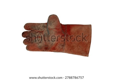 A single, well-worn, red leather work glove with visible dirt and scuffs, isolated on a white background