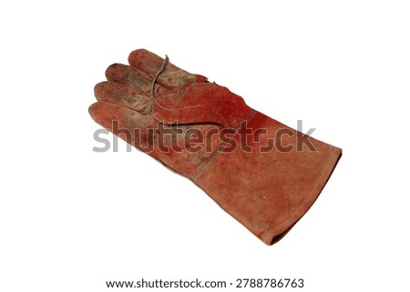 A single, well-worn, red leather work glove with visible dirt and scuffs, isolated on a white background