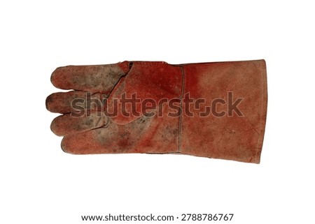 A single, well-worn, red leather work glove with visible dirt and scuffs, isolated on a white background