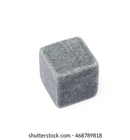 Single whiskey stone cube isolated over the white background