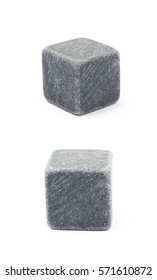 Single whiskey stone cube isolated over the white background, set of two different foreshortenings
