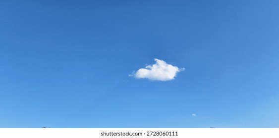 Single White Cloud Floating In Clear Blue Sky Minimal Background