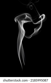 A Single White Smoke Burn From Incense, Shot In Studio With Dark Black Background, For Design And Religion Concept