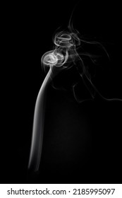 A Single White Smoke Burn From Incense, Shot In Studio With Dark Black Background, For Design And Religion Concept