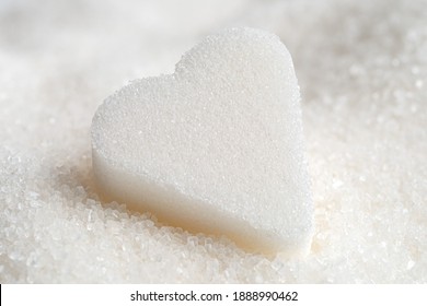 Single White Sugar Heart On Refined Granulated Sugar.