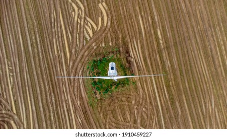 A Single Wind Turbine Generating Power In A Field In Rural Suffolk, UK