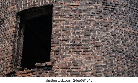 A single window of an old brick tower. High quality photo