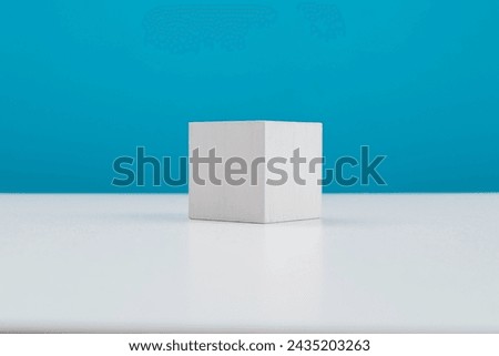 Single wooden cube on table