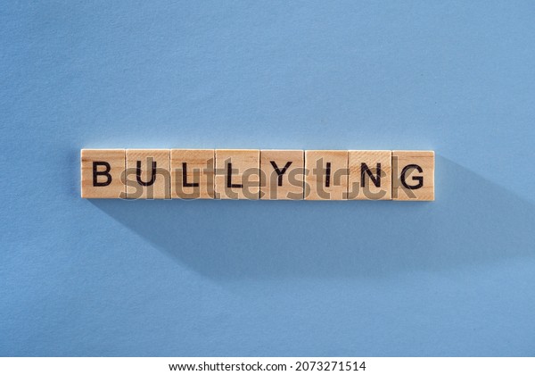 single
word bullying on blue background             
