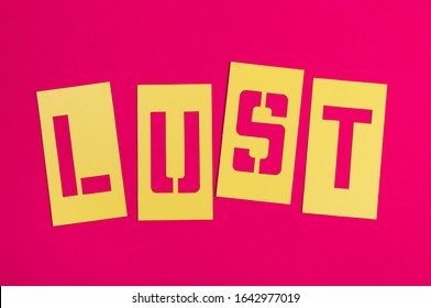 Single Word LUST Spelled Out In Yellow Stencil Lettering On Bright Pink Background