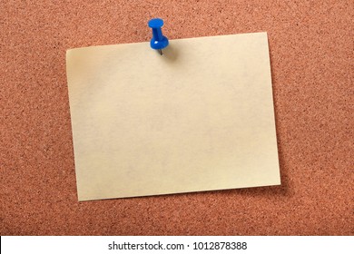 Single Yellow Sticky Post Note Pinned Pushpin Cork Board