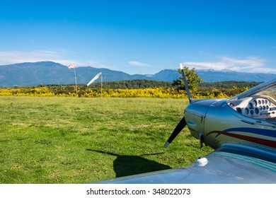 Single-engine plane on a small field on a Sunny day, Abkhazia. 