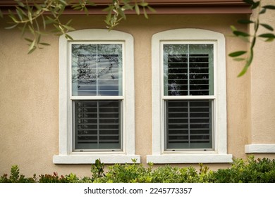 Single-Hung windows on stucco wall, exterior close-up view, Menifee, California