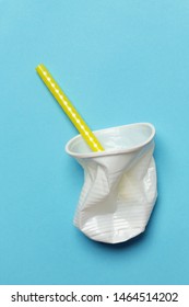 Single-use Plastic Problem - Used Plastic Glass And Drinking Straw On The Colorful Background	