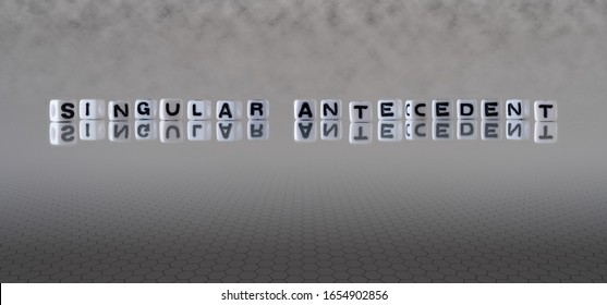 singular antecedent concept represented by black and white letter cubes