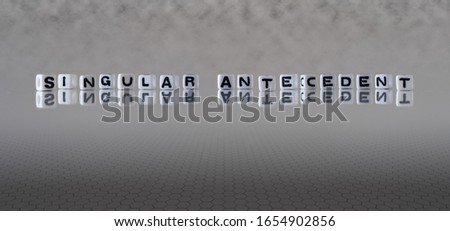 singular antecedent concept represented by black and white letter cubes