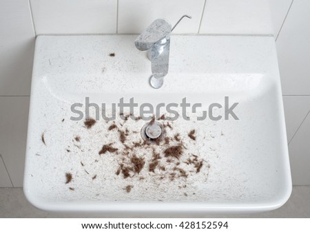 sink after hair cut with trimmer, full of hair
