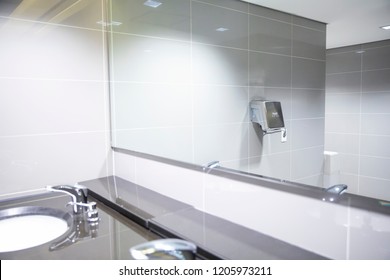 Sink And Mirror In Office Buildings Toilet