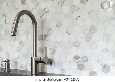 Sink with tile backsplash - Shutterstock ID 709462573