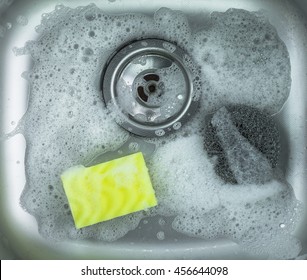 sink and yellow sponge - Powered by Shutterstock