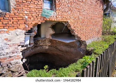 A Sinkhole At The Foot Of The House After The Earthquake