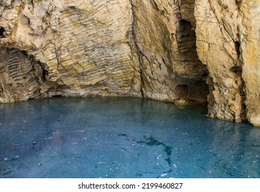 Sinkhole Lake With Blue Water And Rocky Walls In Pyatigorsk Russia